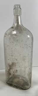 Group of antique glass bottles: various brands