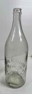 Group of antique glass bottles: various brands