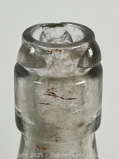 Group of antique glass bottles: various brands