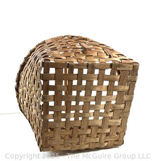 Wicker basket made of brown ash with bent handle