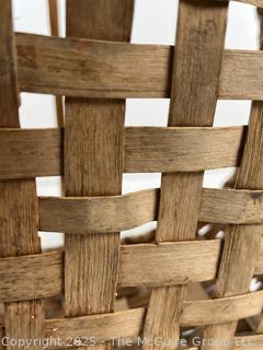 Wicker basket made of brown ash with bent handle