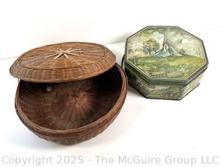 Lidded wicker sewing basket and metal biscuit tin