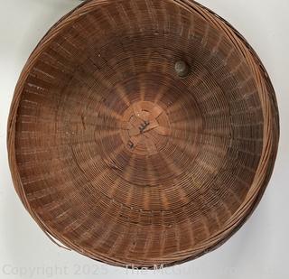 Lidded wicker sewing basket and metal biscuit tin