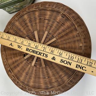 Lidded wicker sewing basket and metal biscuit tin