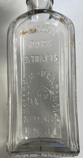 Group of antique glass bottles: various brands
