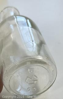Group of antique glass bottles: various brands