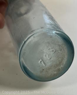 Group of antique glass bottles: various brands