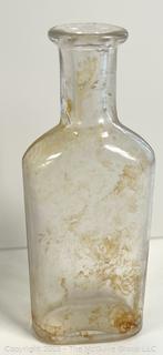 Group of antique glass bottles: various brands