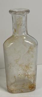 Group of antique glass bottles: various brands