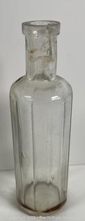 Group of antique glass bottles: various brands