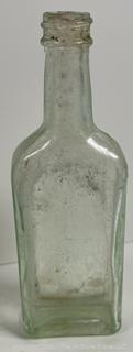 Group of antique glass bottles: various brands