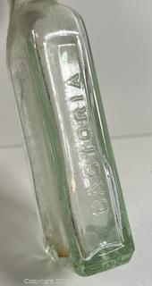 Group of antique glass bottles: various brands