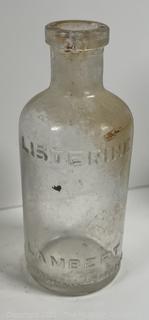Group of antique glass bottles: various brands