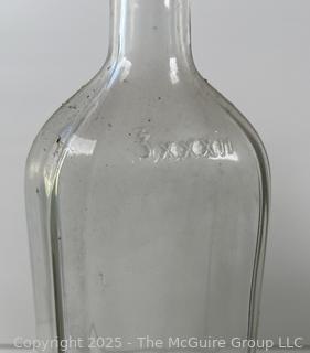 Group of six (6) antique glass bottles: various brands