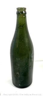 Group of six (6) antique glass bottles: various brands