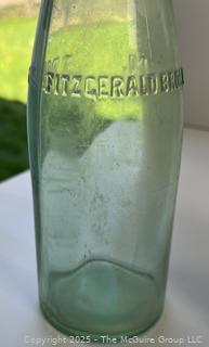Group of six (6) antique glass bottles: various brands