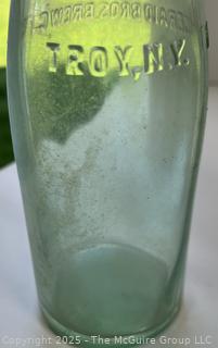 Group of six (6) antique glass bottles: various brands