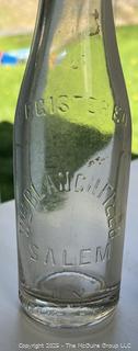 Group of six (6) antique glass bottles: various brands
