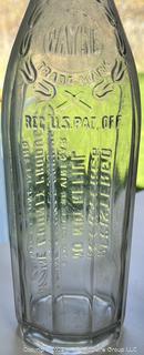 Group of six (6) antique glass bottles: various brands