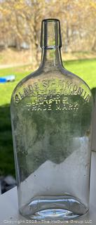 Group of six (6) antique glass bottles: various brands embossed