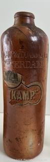 Group of antique glass bottles: various brands some with labels 
