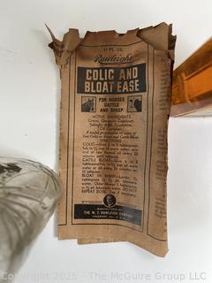 Group of antique glass bottles: various brands some with labels 