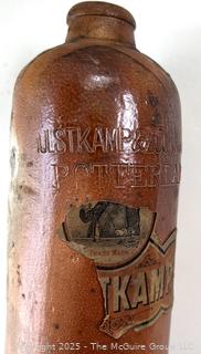 Group of antique glass bottles: various brands some with labels 