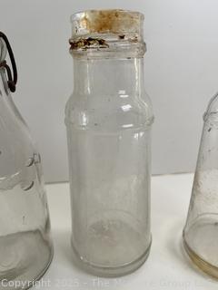 Group antique glass bottles: various brands