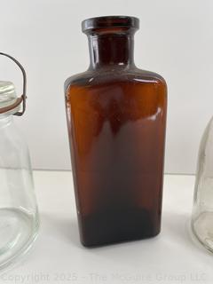 Group antique glass bottles: various brands