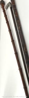 Three (3) ornate Victorian walking sticks/canes: hand-carved, metal pommels, designs