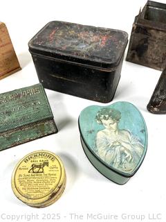 Selection of vintage product advertising tins, mostly home care related