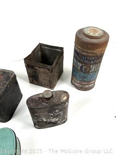 Selection of vintage product advertising tins, mostly home care related