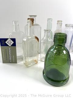 Selection of antique glass bottles mostly medicinal 