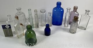 Selection of antique glass bottles mostly medicinal 