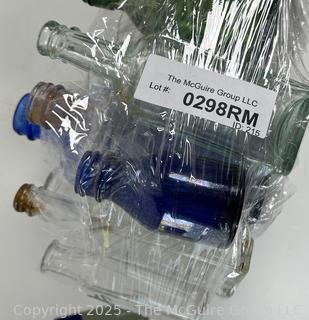 Selection of antique glass bottles mostly medicinal 