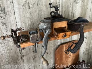 Collection of antique hand-cranked kitchen tools