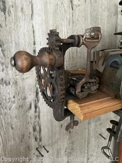 Collection of antique hand-cranked kitchen tools
