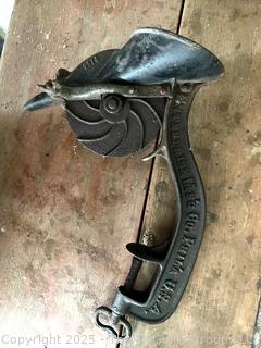 Collection of antique hand-cranked kitchen tools