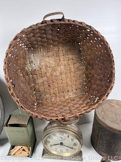 ????????  Eclectic grouping: metal tray; coffee tin; Hanging match holder; hack saw; alarm clock and wicker basket 