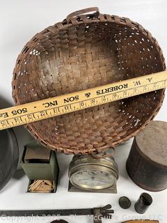 ????????  Eclectic grouping: metal tray; coffee tin; Hanging match holder; hack saw; alarm clock and wicker basket 