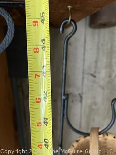 Hanging wrought iron hooked stand with wicker basket assortment 