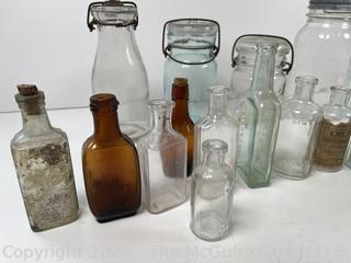 Large group of antique bottles and canning jars: various brands