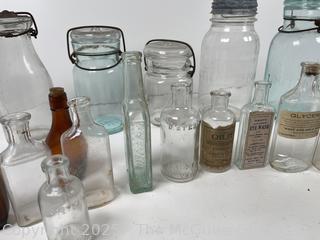 Large group of antique bottles and canning jars: various brands