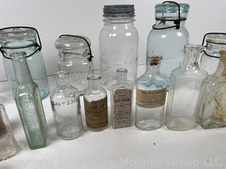 Large group of antique bottles and canning jars: various brands