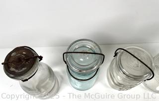Large group of antique bottles and canning jars: various brands