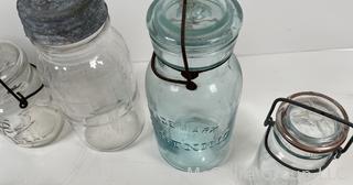 Large group of antique bottles and canning jars: various brands