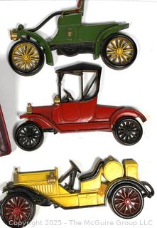 Three (3) Sexton Metal Car Wall Hangings Antique Cars; Drafting tools in storage case; and Vintage Ledger Book