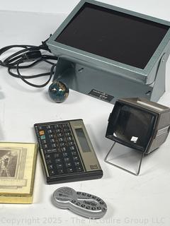 Grouping Including 1966 Barbie Twist'n'turn Doll, Apple iPOD Classic 3rd Generation (Model A1040), Farley's Chromatic-C Pocket Tones, HP 12C Calculator, Chinese Character Ink Stamp, TM-40 - Digital Tuner Metronome, Parker and Pelican Ink Bottles and Slide Viewer