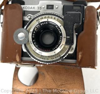 Kodak No.1 Kodamatic Rangefinder 35 MM Film Camera. Stamped "US Navy" with Leather Case and Nikon Leather Case 