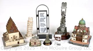 Collection of Travel Souvenirs Including Coin Banks and Figurines of Buildings